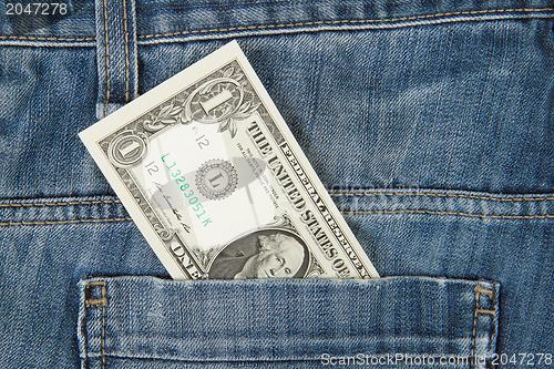 Image of Macro shot of trendy jeans with american 1 dollar bill