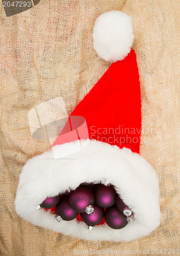 Image of Santas hat filled with Christmas balls