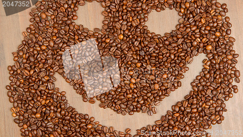 Image of Coffee grains arranged in smiley