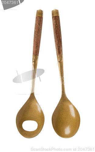 Image of Old brass serving spoons isolated