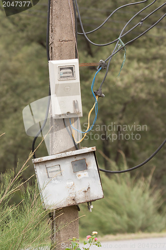 Image of Cabinet with electrical meter on a concrete pole