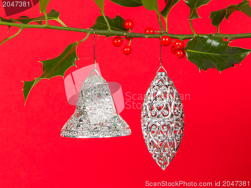 Image of Old silver bells hanging in Butcher's broom