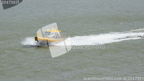 Image of Yellow Crewtender at high speed