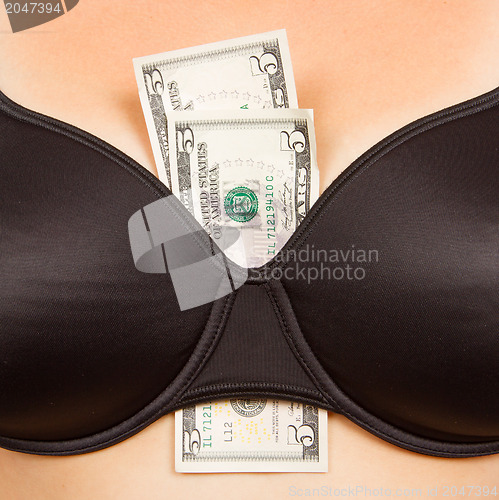 Image of Concept - woman with cash in a bra