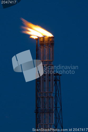 Image of Burning oil gas flare during the night 