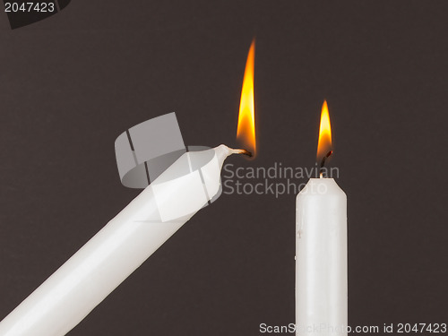 Image of Burning white candle, isolated