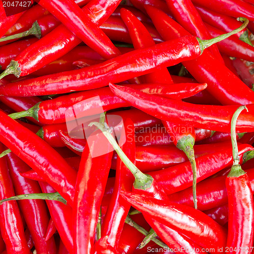 Image of Heap Of Ripe Big Red Peppers At A Street Market In Dong Hoi