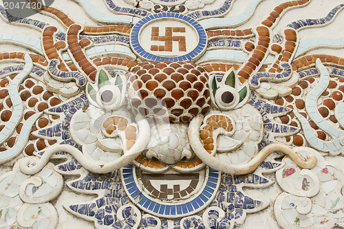 Image of Chinese dragon ornament on a rooftop