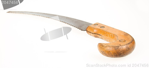 Image of Old rusty toy hand saw on white