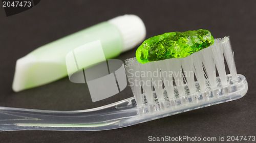 Image of Toothbrush and green toothpaste isolated