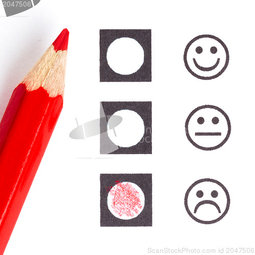 Image of Red pencil choosing the right smiley