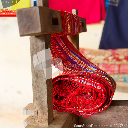 Image of Handmade silk textile industry, silk scarf on a old machine