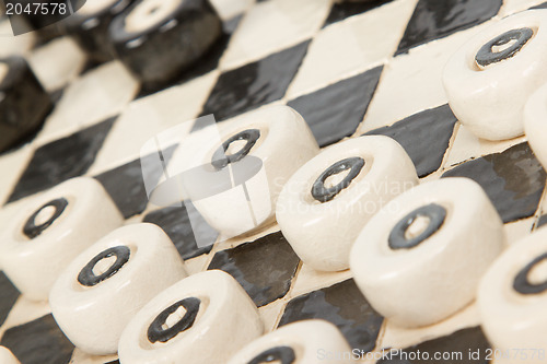 Image of Very old game of checkers, pottery