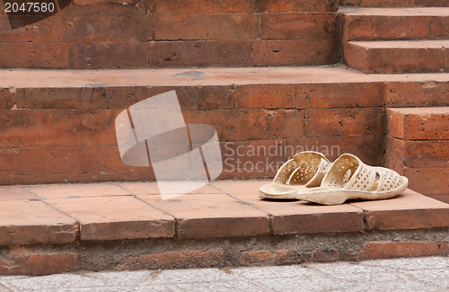 Image of Shoes at the entrance of a mosque 