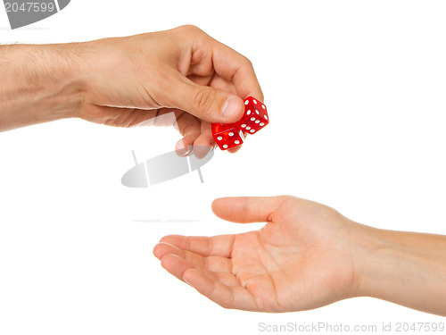 Image of Two red dice being given