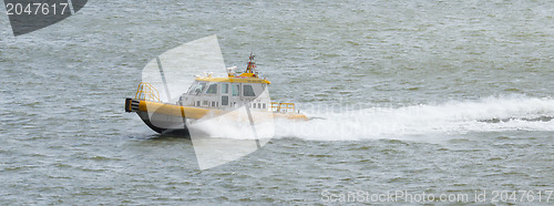 Image of Yellow Crewtender at high speed
