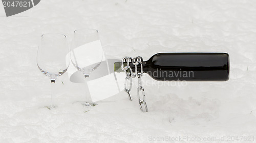 Image of Bottle of red wine and wineglasses isolated