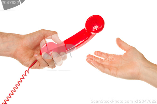 Image of Man giving red telephone to woman