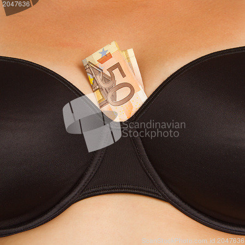 Image of Concept - woman with cash in a bra