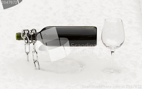 Image of Bottle of red wine and wineglasses isolated
