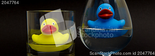Image of Blue and yellow rubber duck in glasses