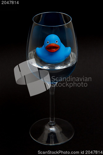 Image of Blue rubber duck in a wineglass