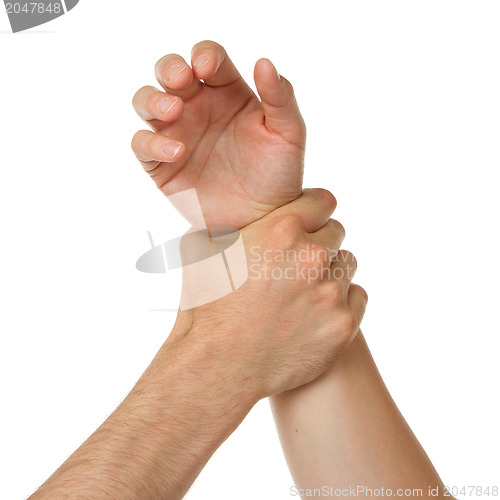Image of Man holding woman by wrist