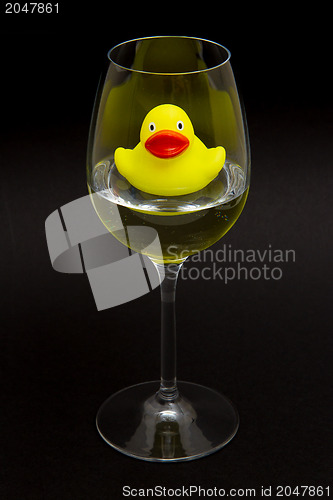 Image of Yellow rubber duck in a wineglass