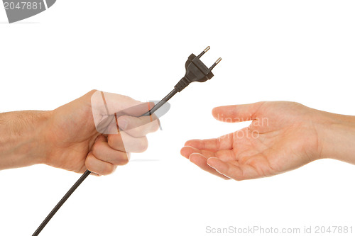 Image of Man giving electric plug