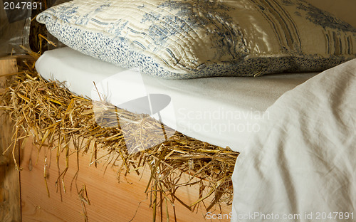 Image of Bed on top of a haystac