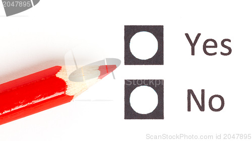 Image of Red pencil choosing between yes or no