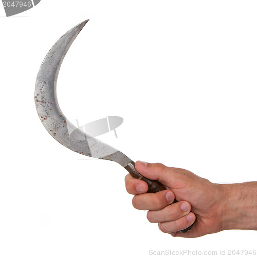 Image of Man holding a rusted sickle