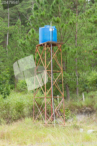 Image of Primitive blue water tower 