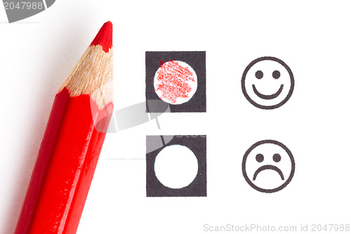 Image of Red pencil choosing the right smiley