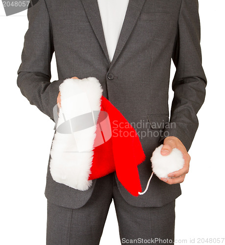Image of Business man with a santa hat 