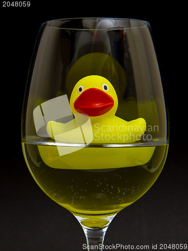 Image of Yellow rubber duck in a wineglass