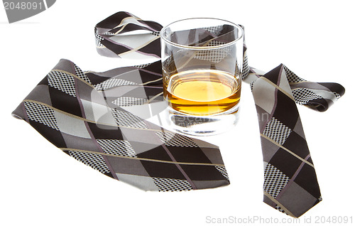 Image of Glass of whisky and a tie