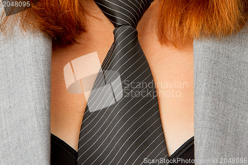 Image of Caucasian business woman with a tie