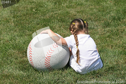 Image of Small Girl Large Baseball