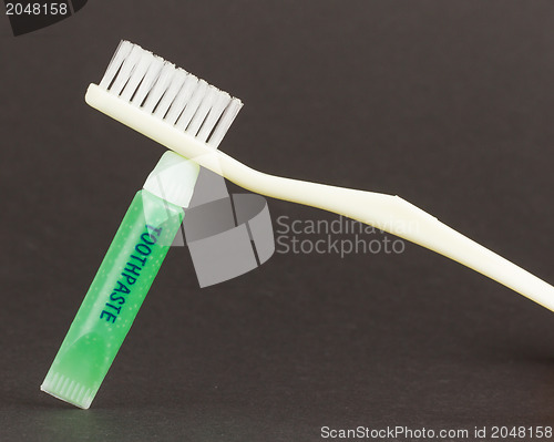Image of Toothbrush and green toothpaste isolated