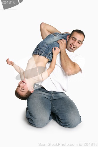 Image of Father playing with young boy