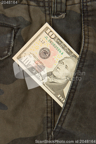 Image of Macro shot of trendy jeans with american 10 dollar bill