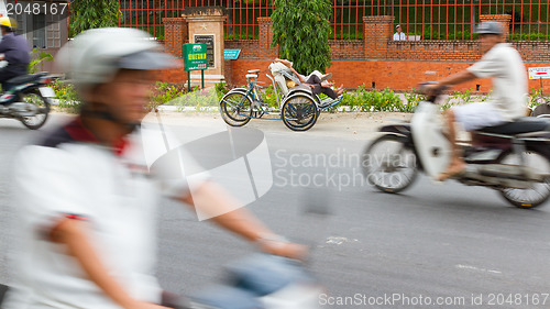 Image of DA NANG, VIETNAM, 31 JULY 2012. Sleeping cyclo driver in it's ow