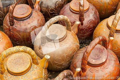 Image of Many teapots waiting to be sold at a factory