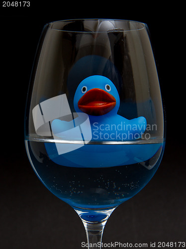 Image of Blue rubber duck in a wineglass