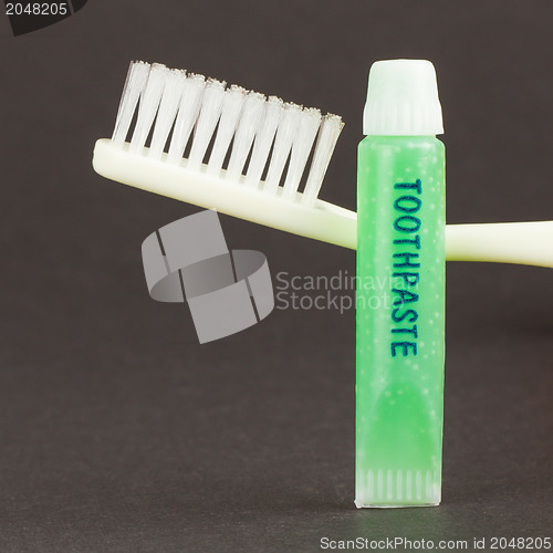 Image of Toothbrush and green toothpaste isolated