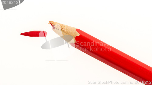 Image of Broken pencil on a white piece of paper 