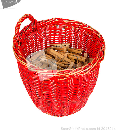 Image of Very old red basket with wooden clothespins