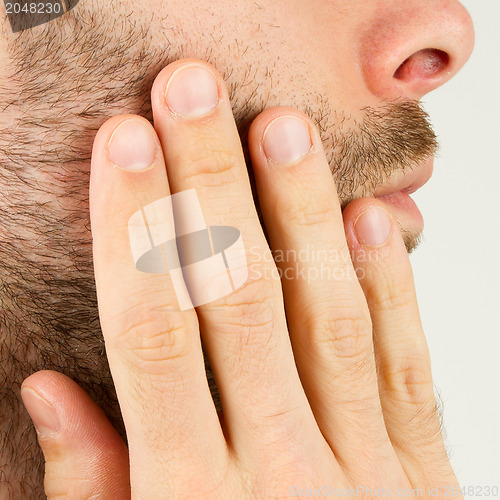 Image of Close-up of a young man shaving