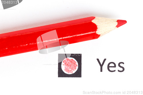 Image of Red pencil choosing between yes or no
